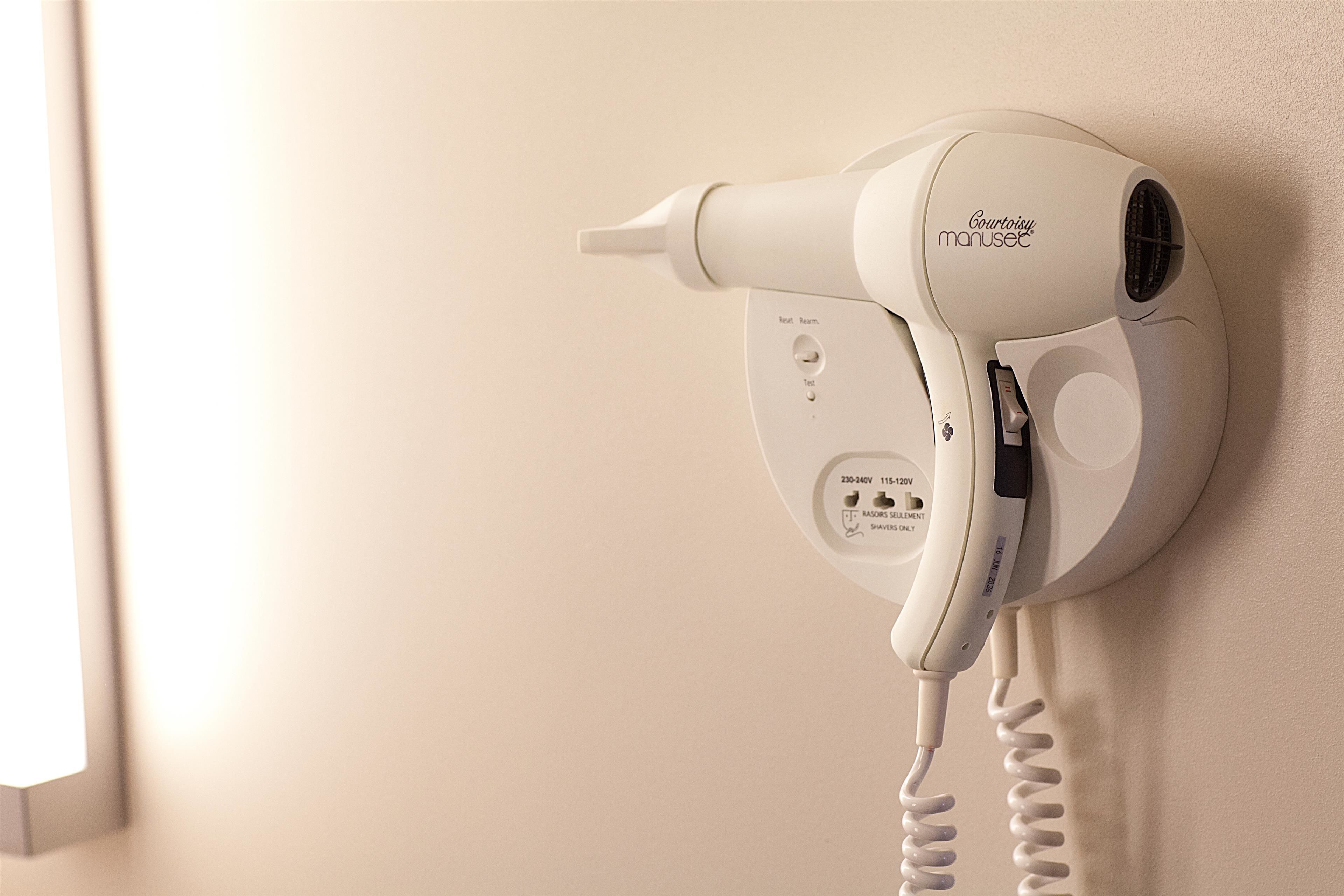 eco-friendly toiletries, hair dryer, towels