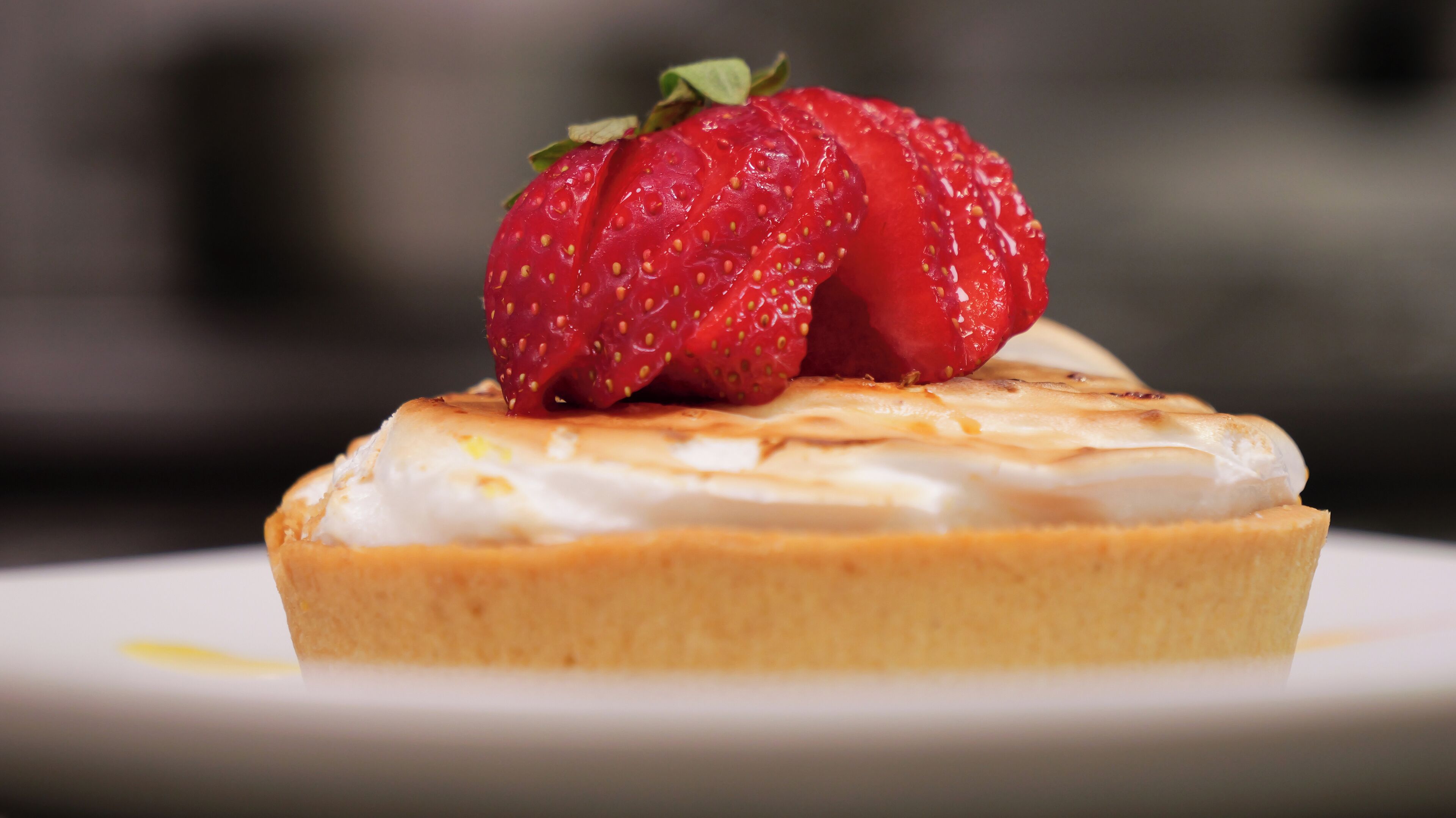 A dessert with a strawberry on top.