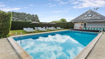 Seasonal outdoor pool, open 9:00 AM to 8:00 PM, pool umbrellas