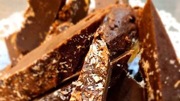 A close-up of chocolate-covered treats with oats.