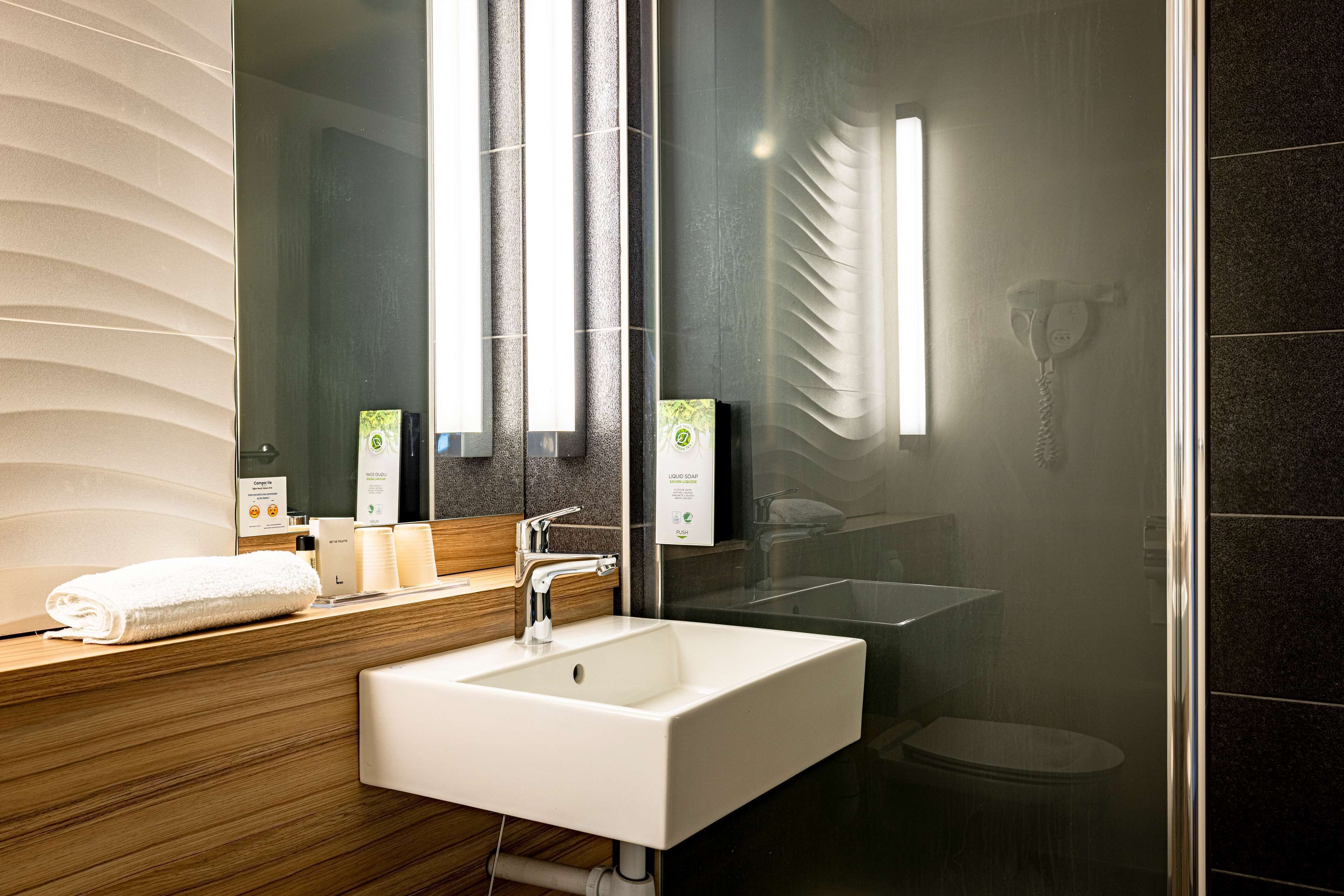 eco-friendly toiletries, hair dryer, towels