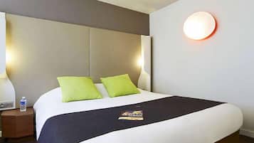 Premium bedding, desk, laptop workspace, blackout curtains