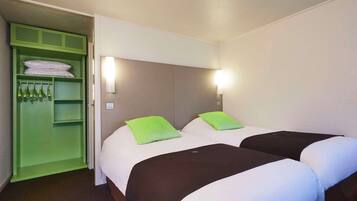 Premium bedding, desk, laptop workspace, blackout drapes