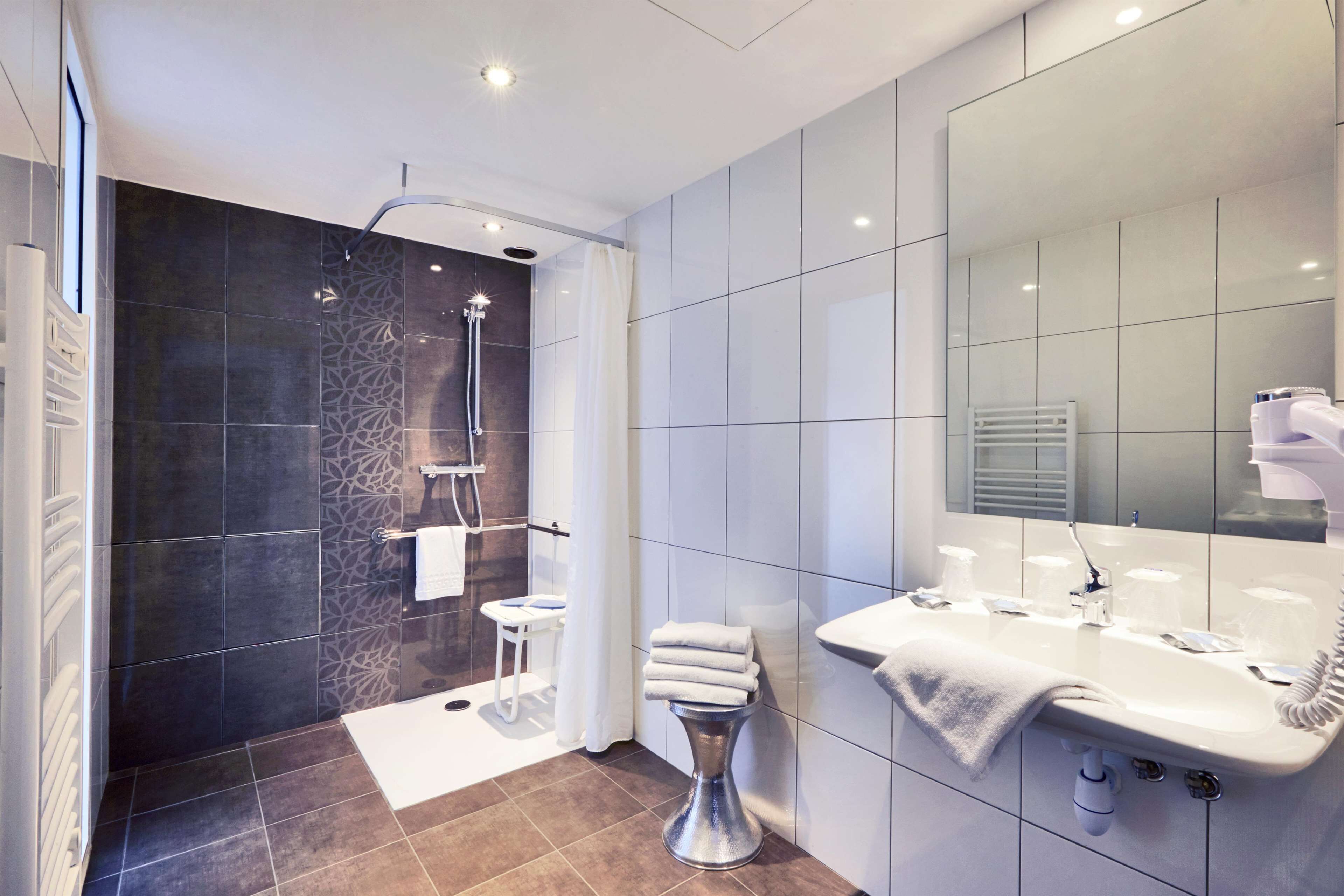 shower, eco-friendly toiletries, hair dryer, towels