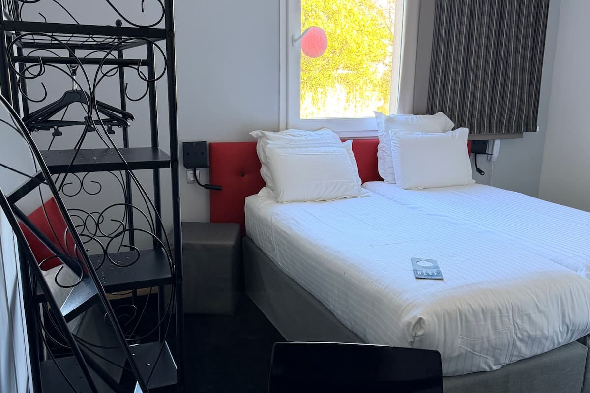 Comfort Room | Desk, laptop workspace, blackout drapes, soundproofing