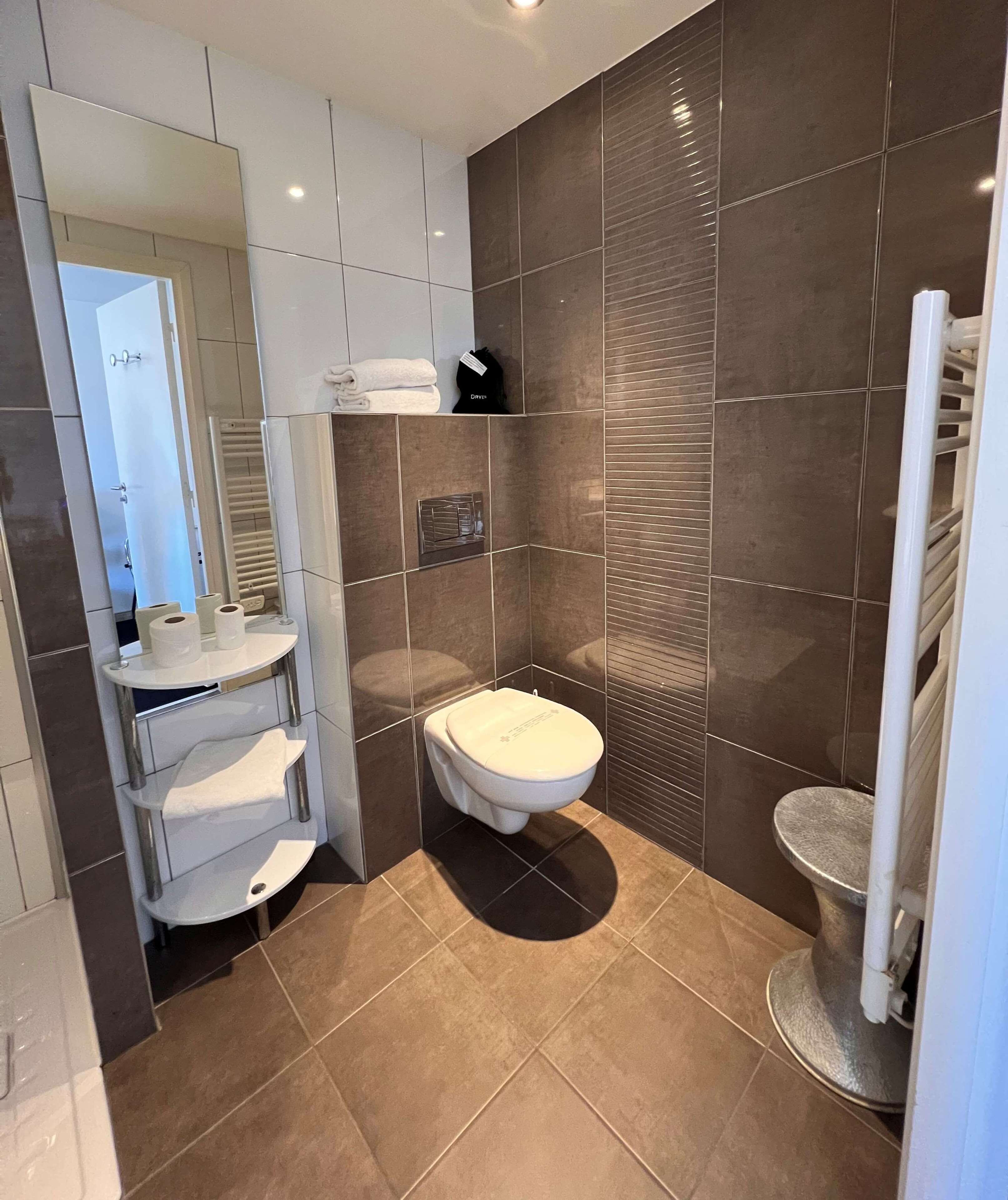 shower, eco-friendly toiletries, hair dryer, towels