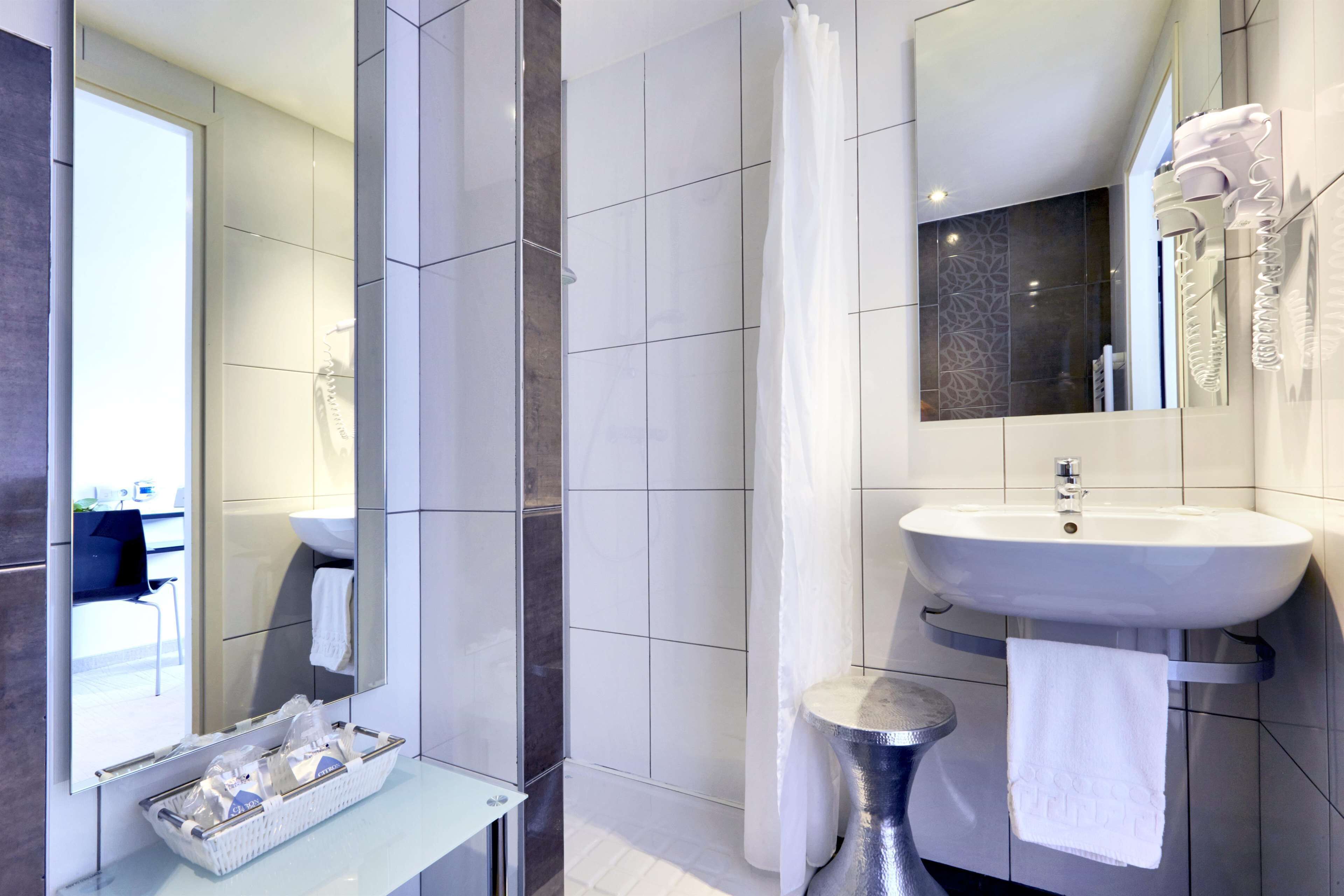 shower, eco-friendly toiletries, hair dryer, towels