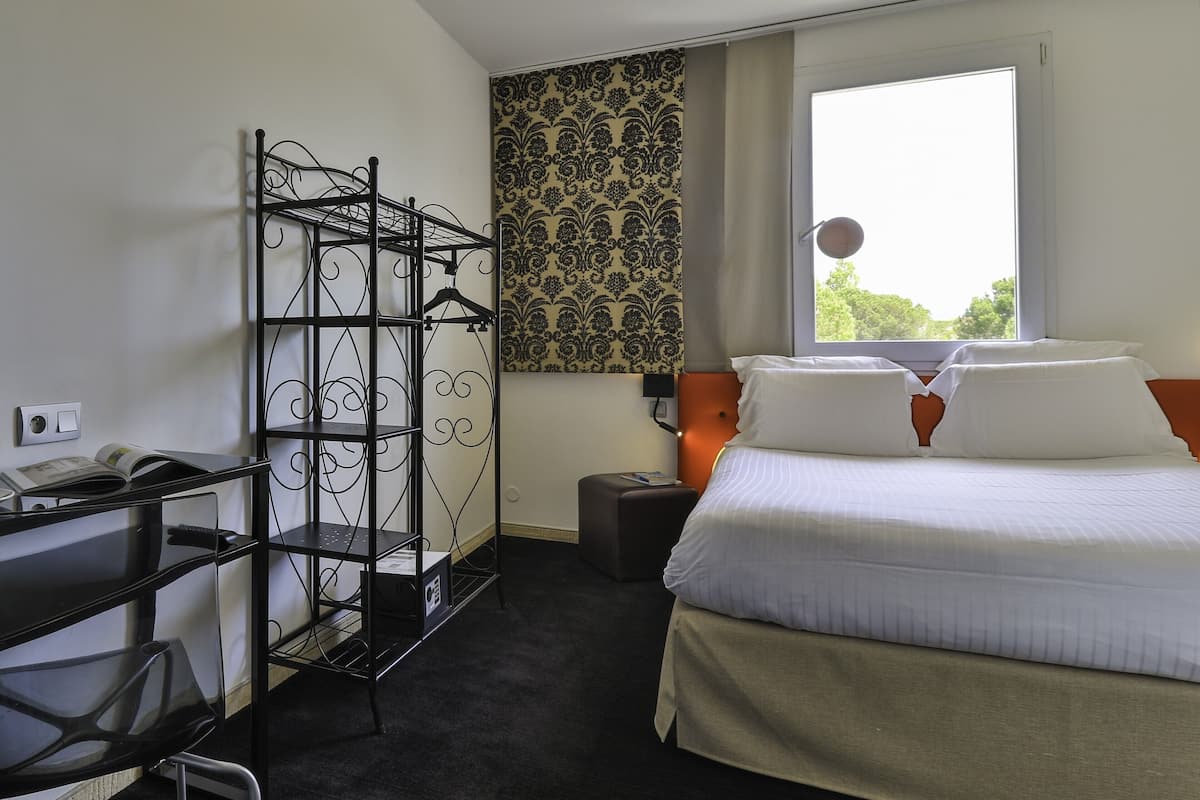 Comfort Room | Desk, laptop workspace, blackout drapes, soundproofing