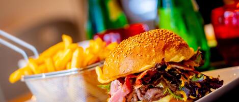 A meal consisting of a sandwich and fries on a plate.