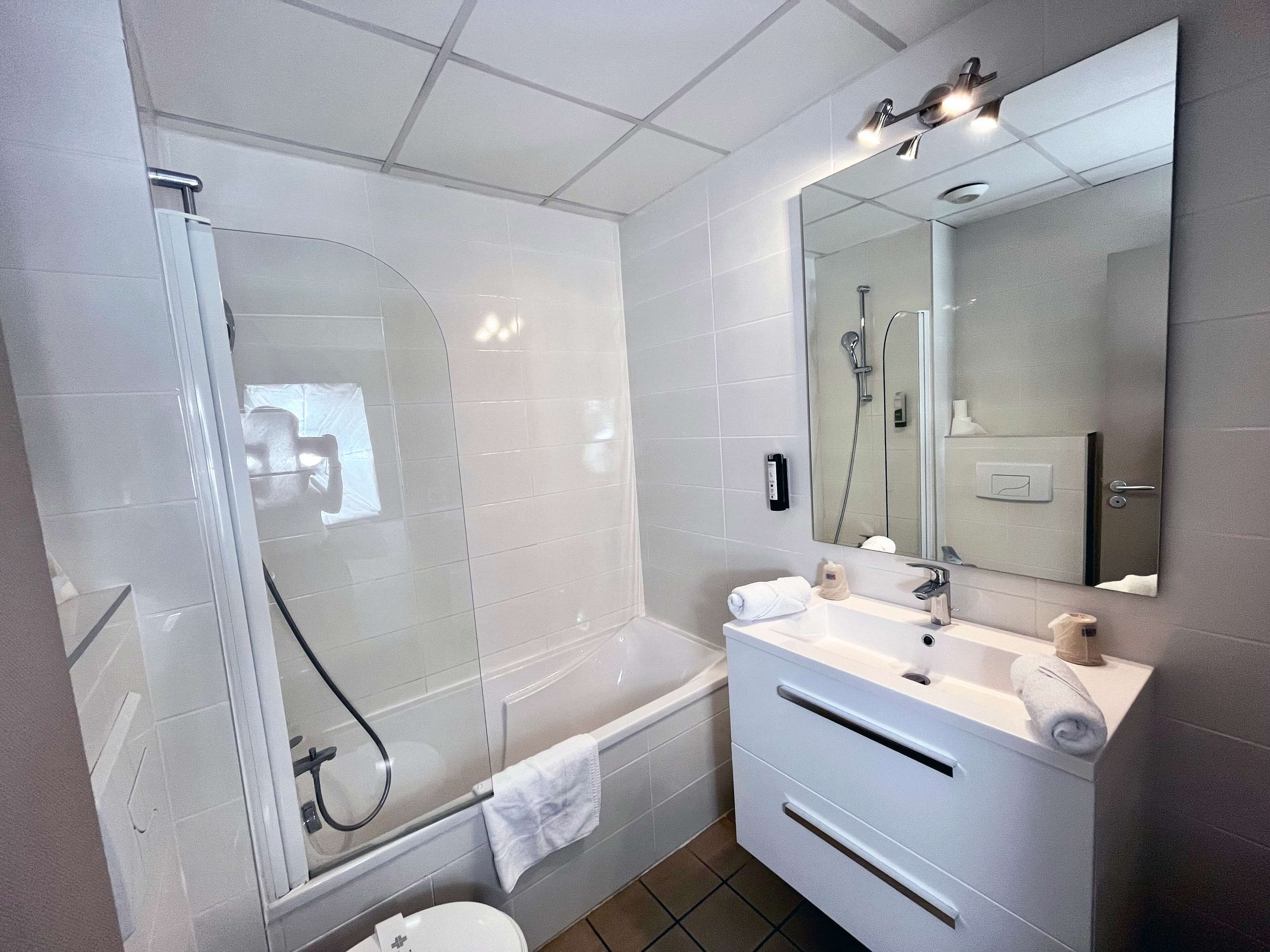 shower, eco-friendly toiletries, hair dryer, slippers