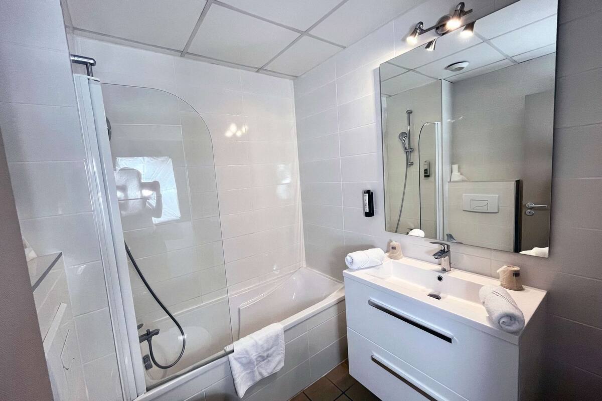 shower, eco-friendly toiletries, hair dryer, slippers