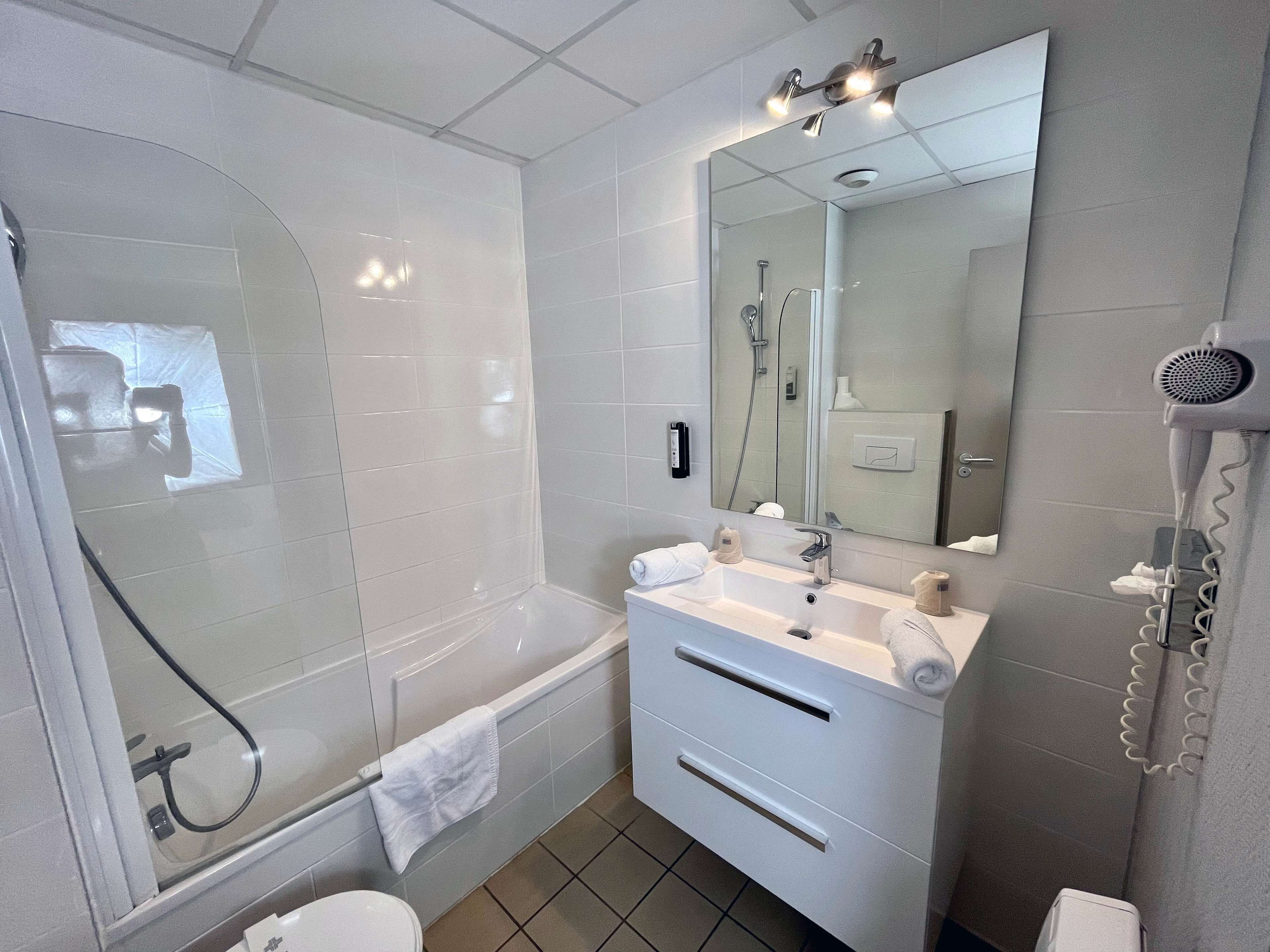 shower, eco-friendly toiletries, hair dryer, slippers