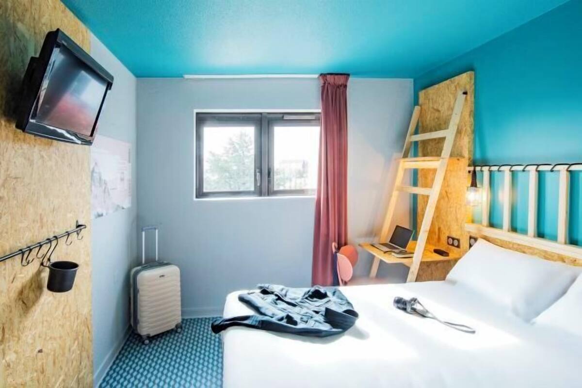 Premium bedding, desk, laptop workspace, blackout curtains