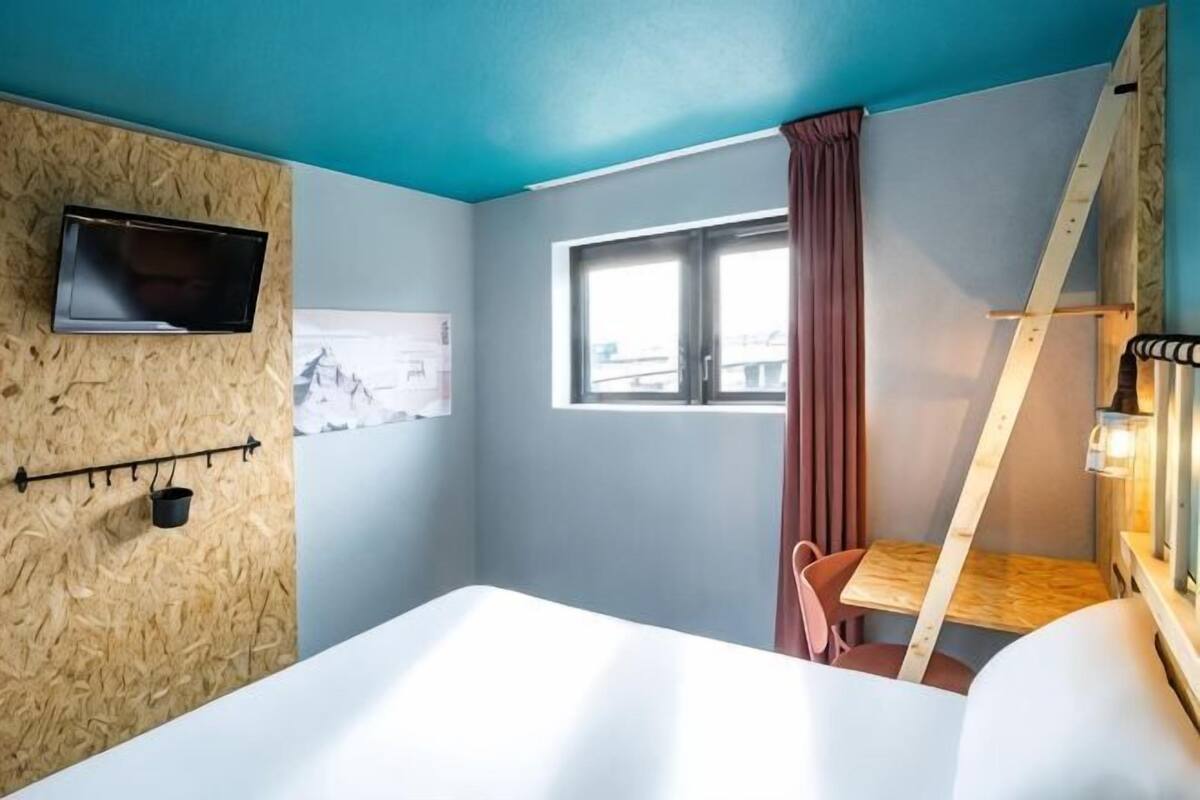Premium bedding, desk, laptop workspace, blackout curtains