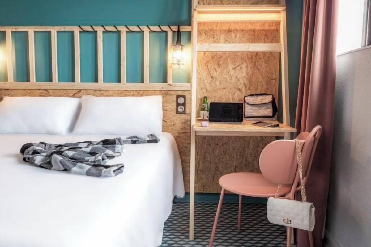 Premium bedding, desk, laptop workspace, blackout curtains
