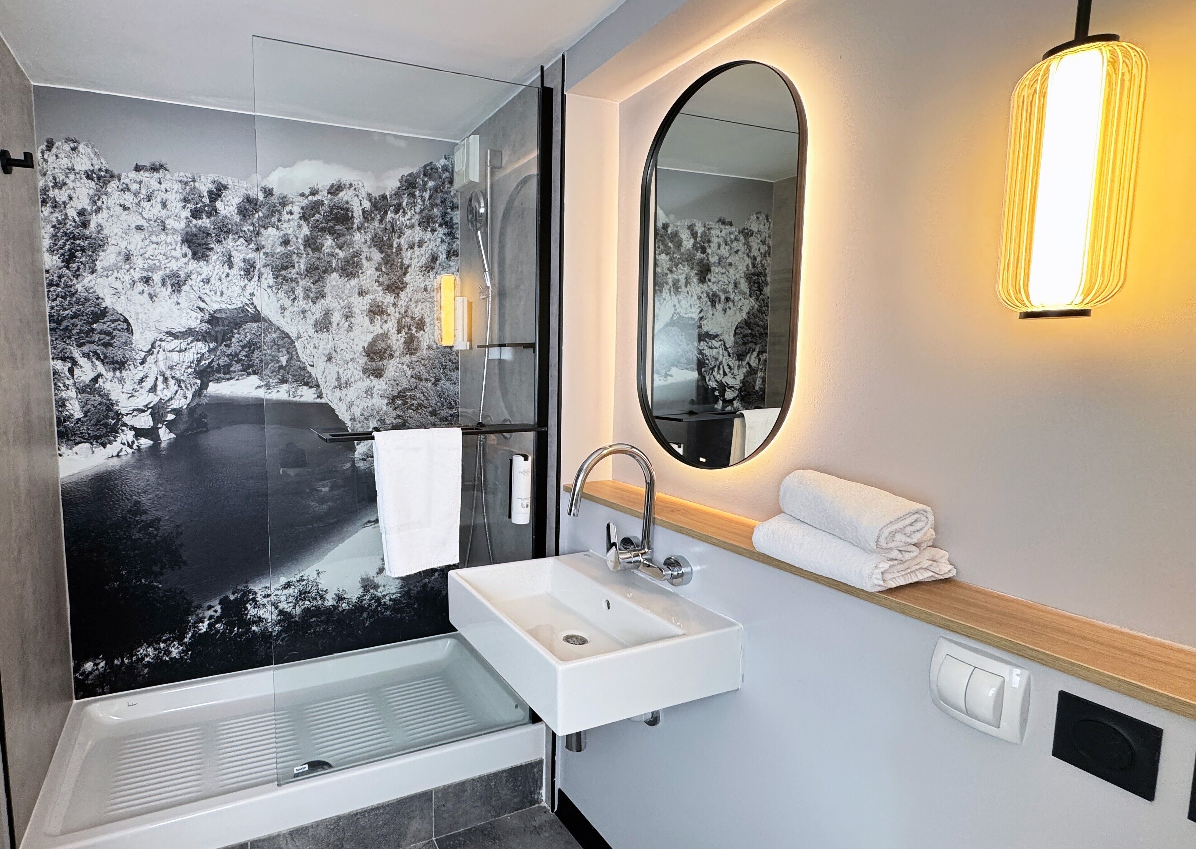 rainfall showerhead, eco-friendly toiletries, hair dryer, towels