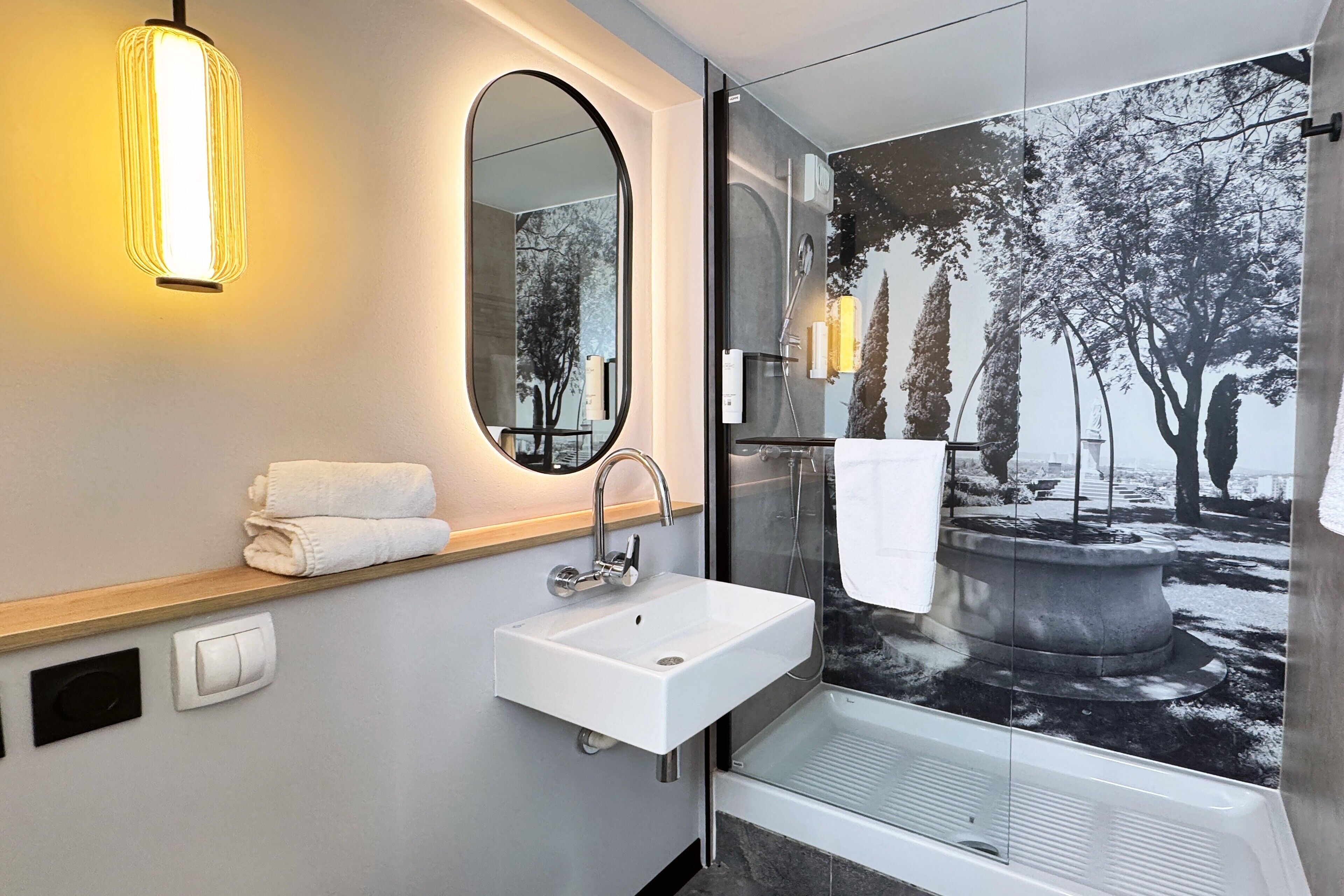 rainfall showerhead, eco-friendly toiletries, hair dryer, towels