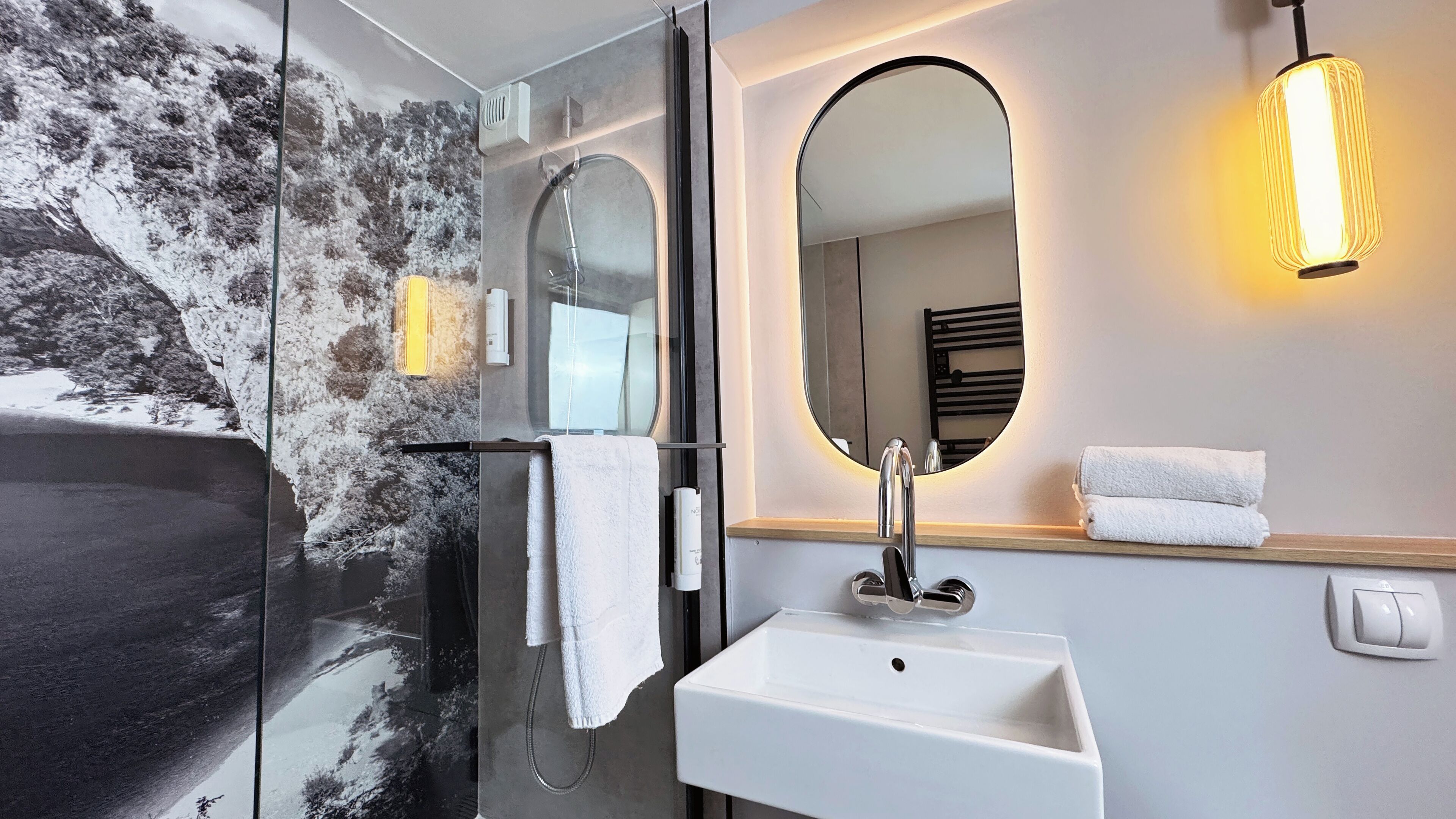 rainfall showerhead, eco-friendly toiletries, hair dryer, towels