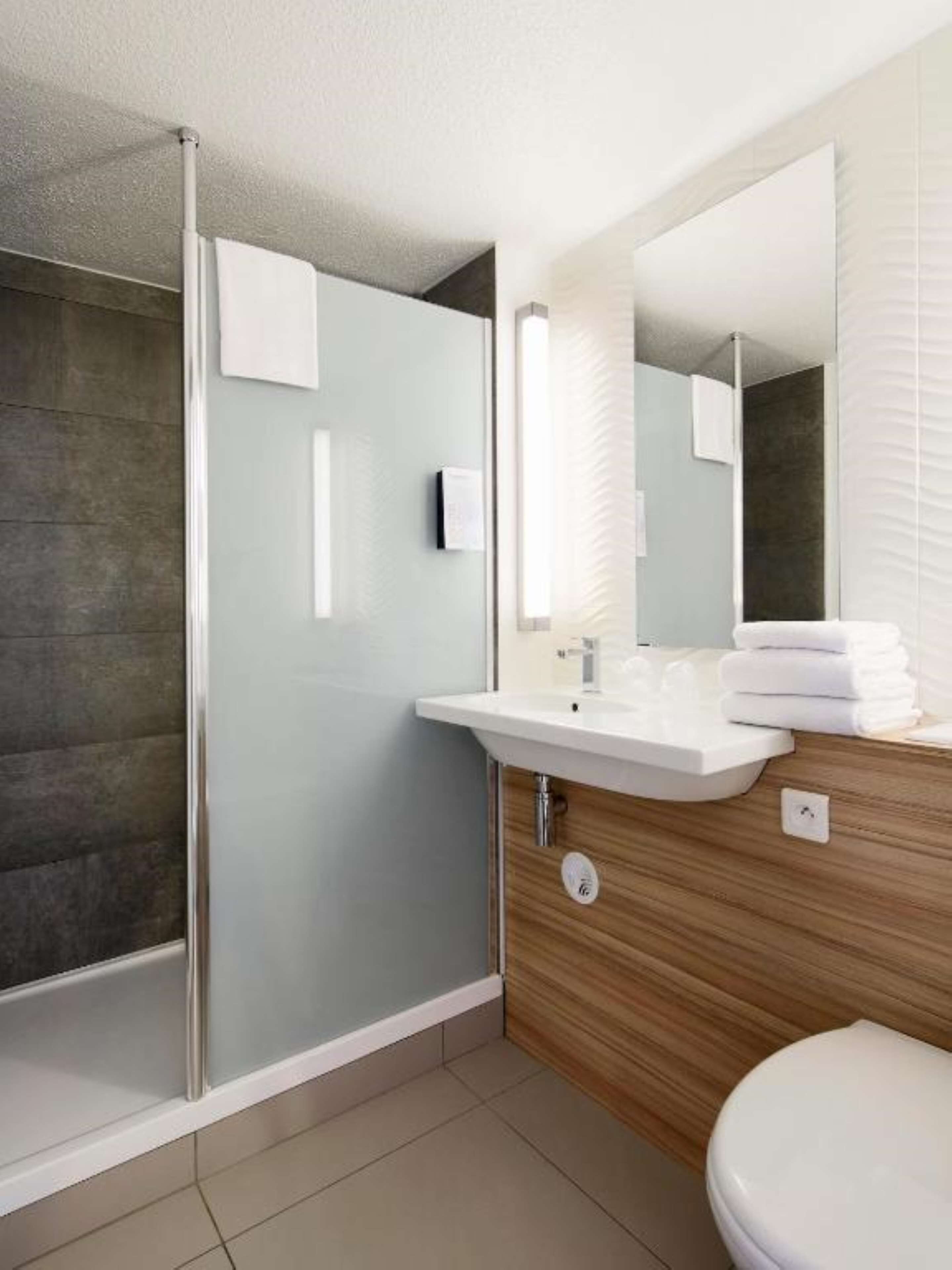 eco-friendly toiletries, hair dryer, towels