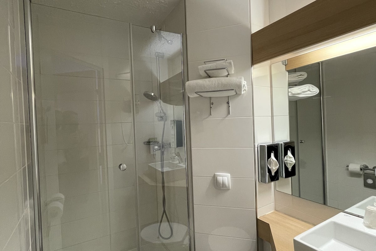 shower, eco-friendly toiletries, hair dryer, towels