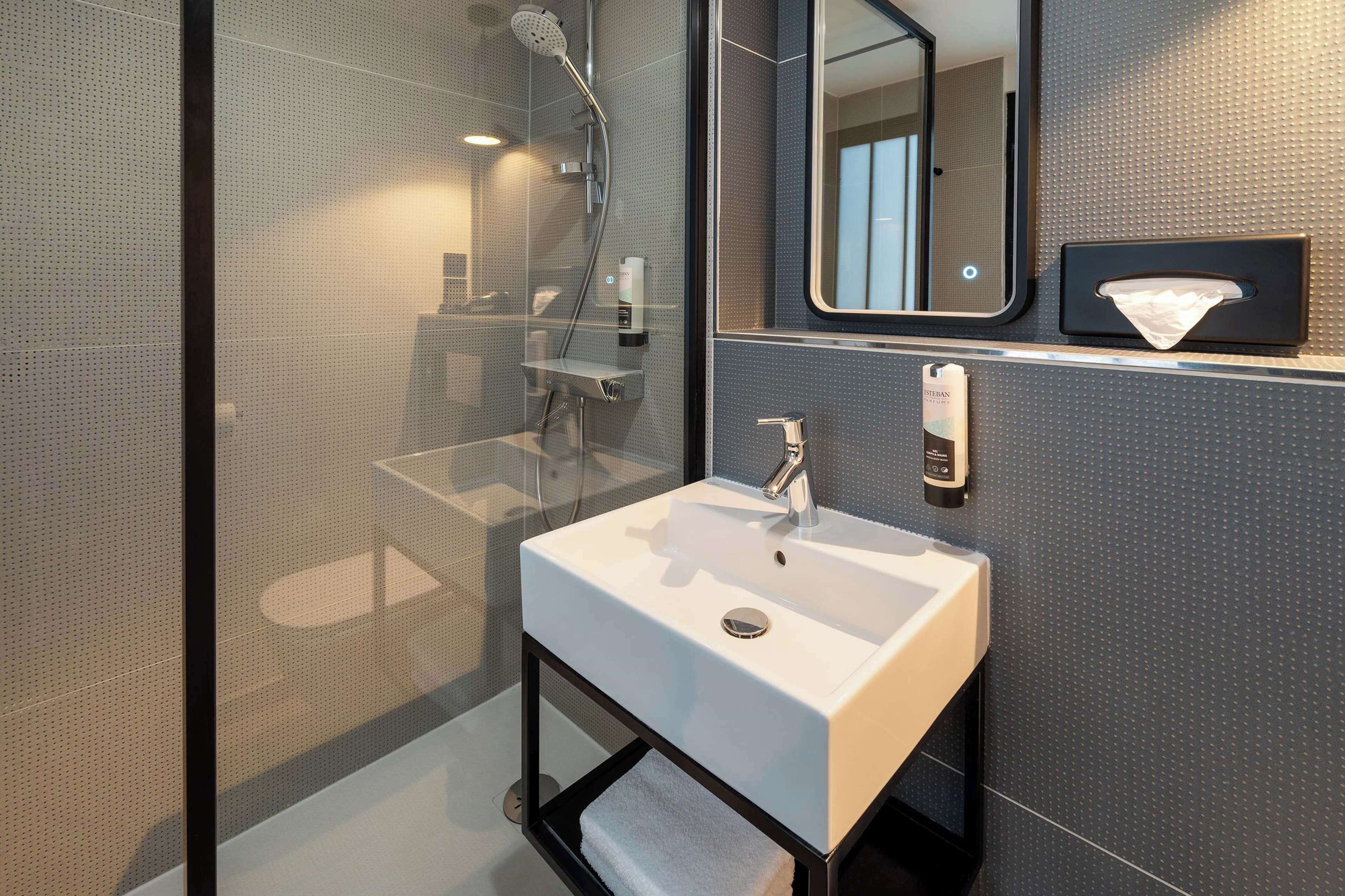 shower, eco-friendly toiletries, hair dryer, towels