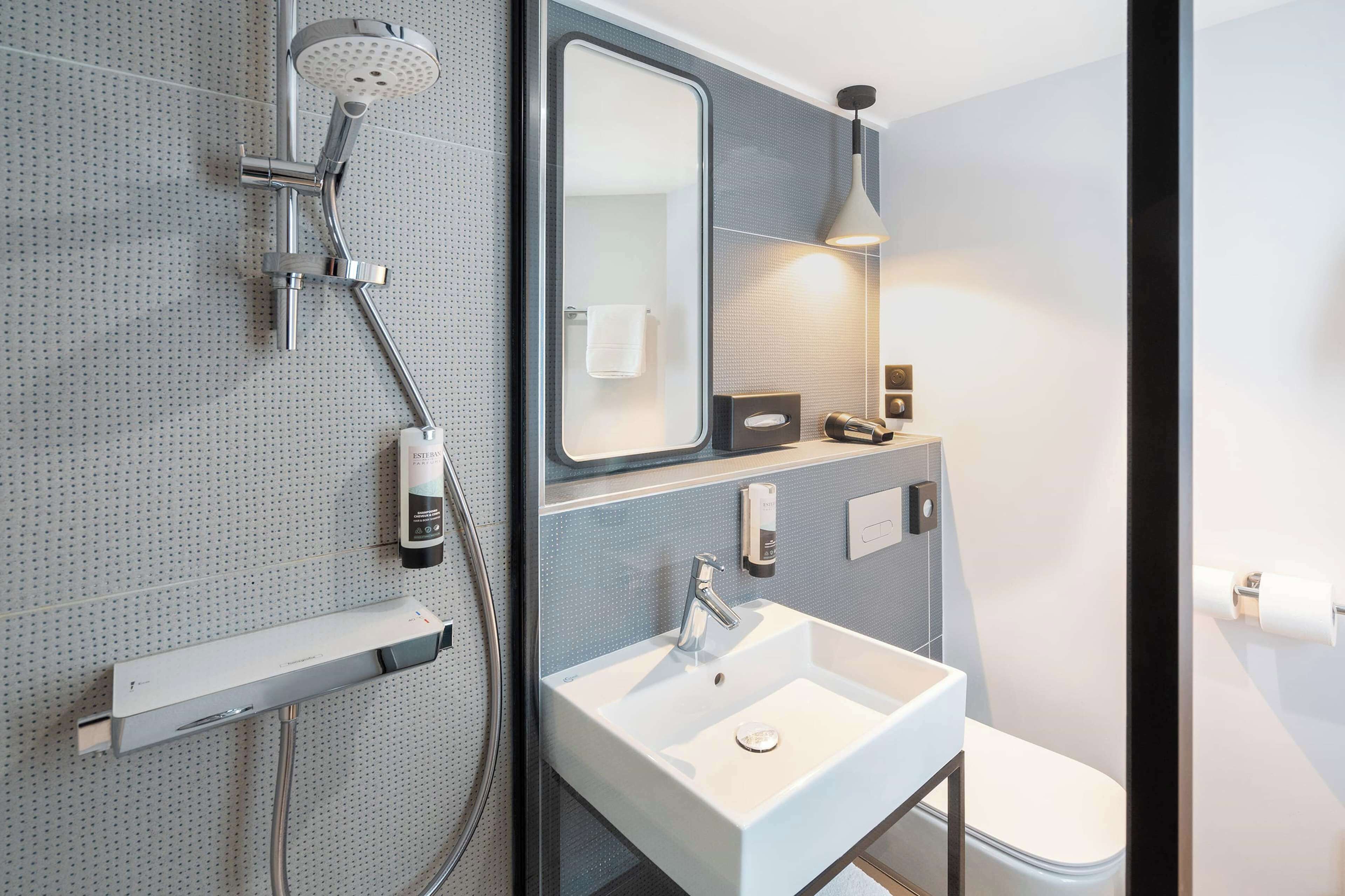 shower, eco-friendly toiletries, hair dryer, towels