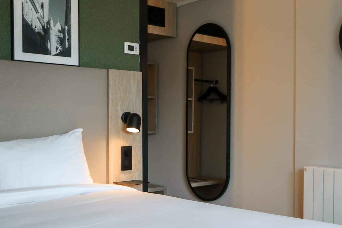 Premium bedding, desk, blackout drapes, iron/ironing board