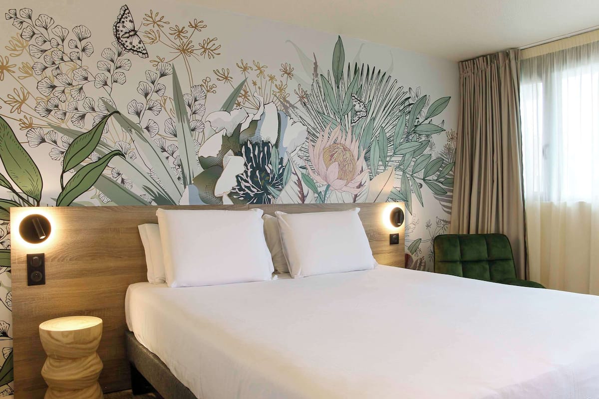 Premium bedding, desk, laptop workspace, blackout drapes