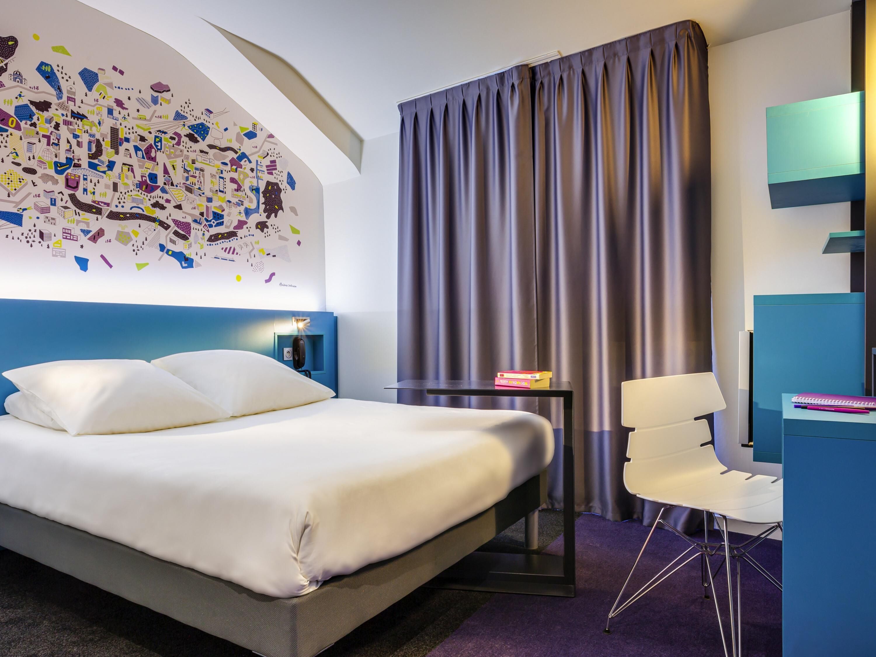 Luxe beddengoed, een minibar, een kluis op de kamer, een bureau