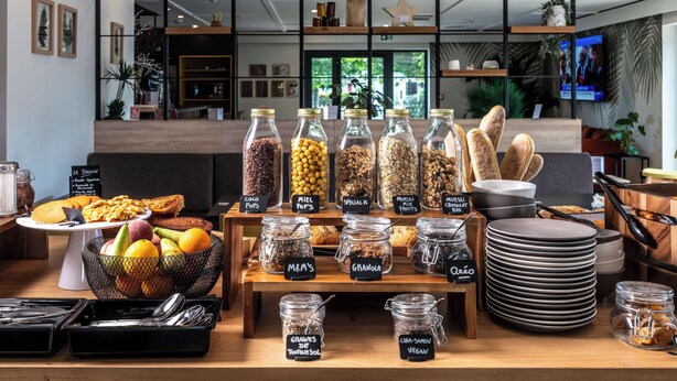 A breakfast buffet with various food items and condiments. - Campanile NATURE - Metz Sud Jouy aux Arches (Jouy-aux-Arches)