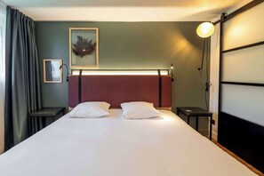 Premium bedding, desk, laptop workspace, blackout curtains