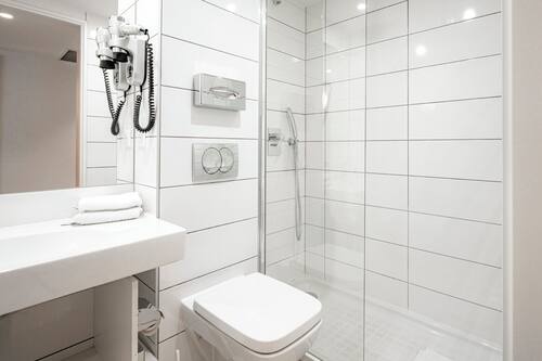 Shower, eco-friendly toiletries, hair dryer, towels