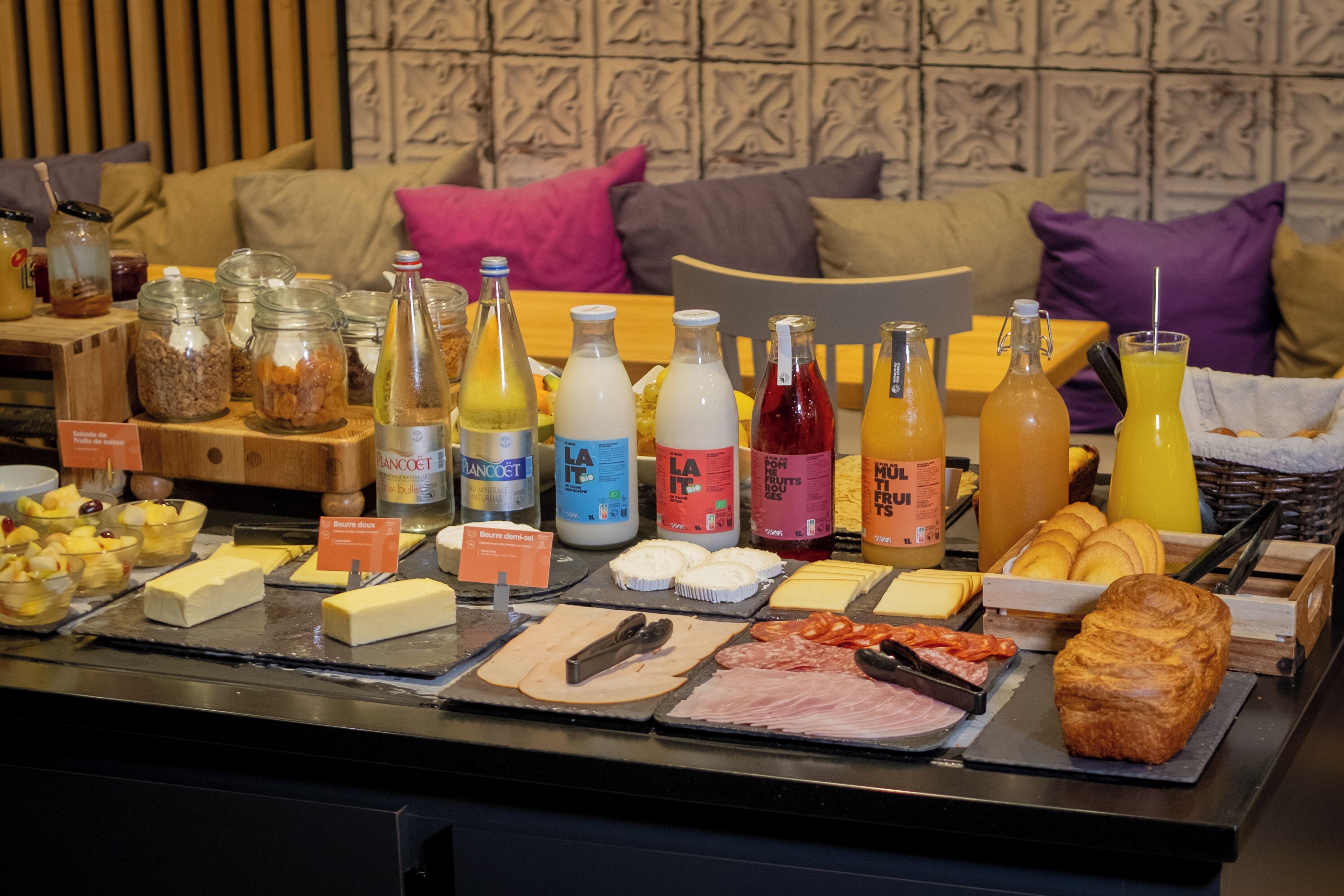 A breakfast buffet with various food items and beverages.