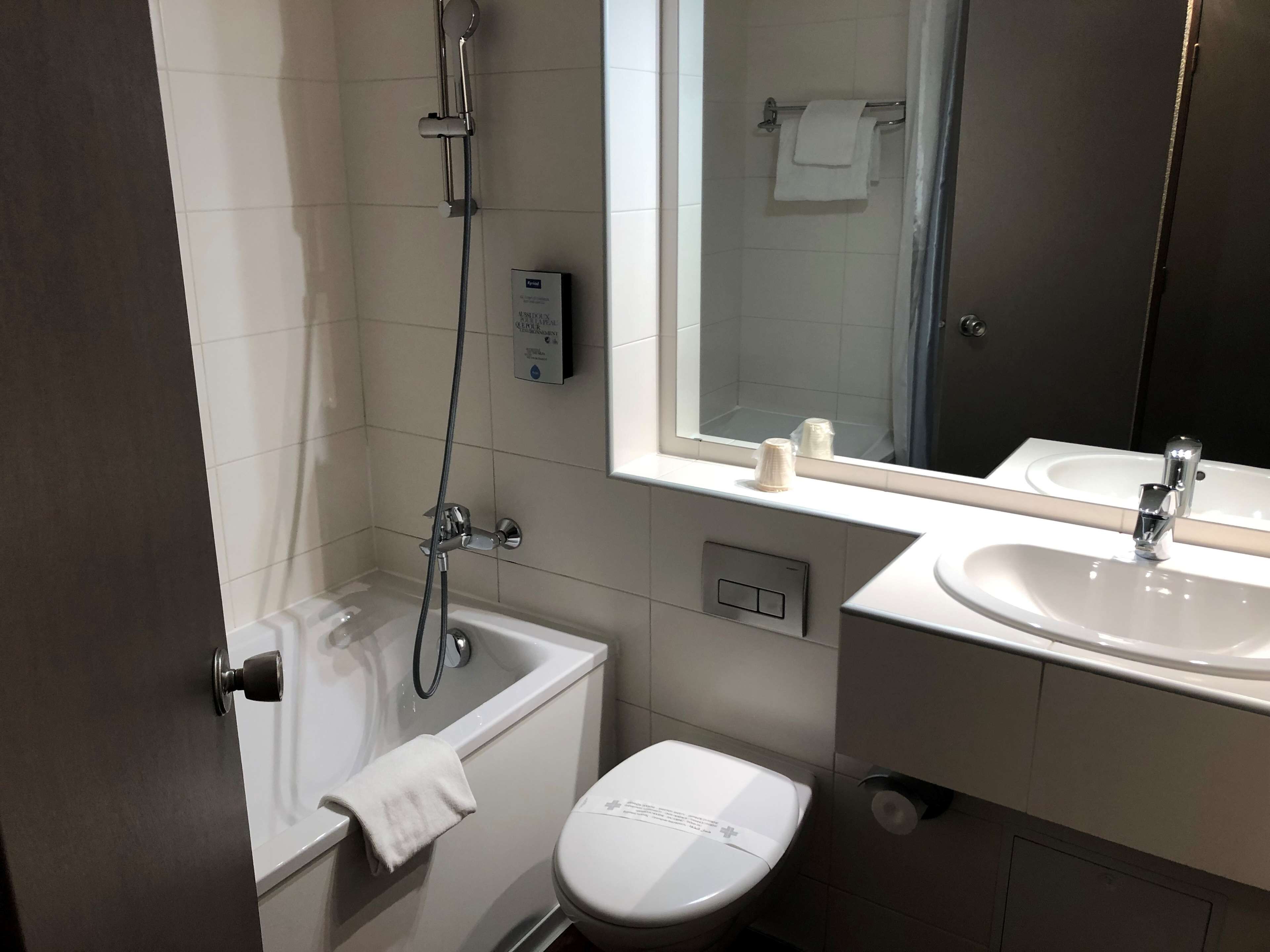 bathtub, eco-friendly toiletries, hair dryer, towels