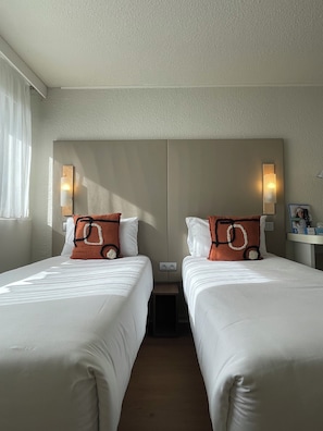 Comfort Twin Room | Premium bedding, desk, laptop workspace, blackout drapes