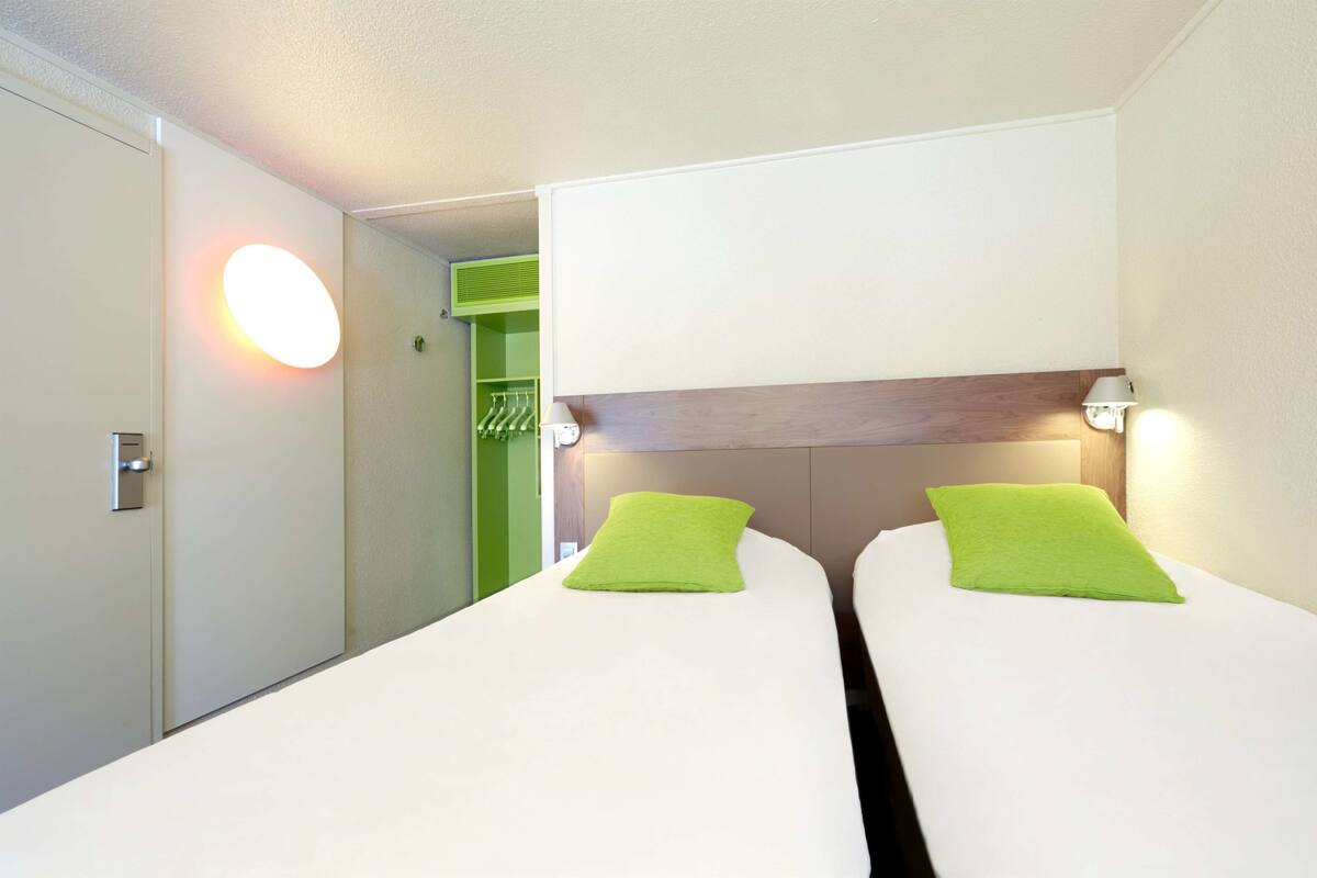 Premium bedding, desk, laptop workspace, blackout curtains