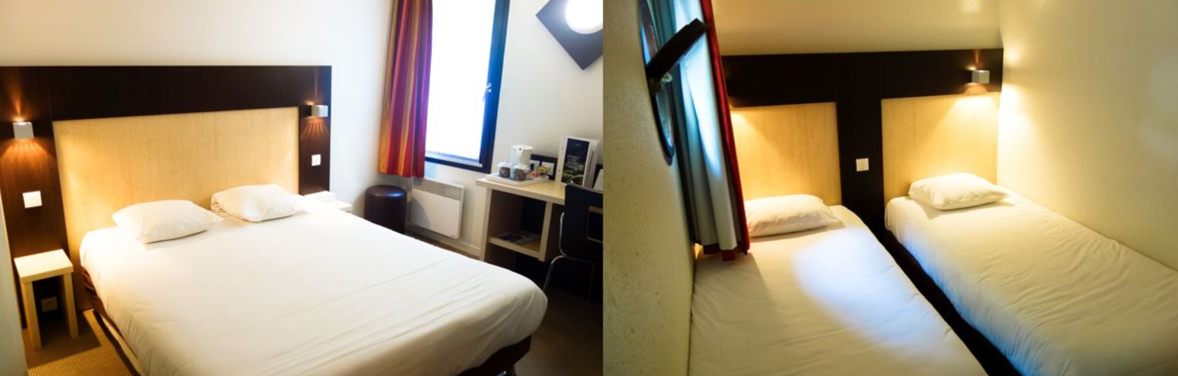 Habitación de hotel con dos camas individuales, un escritorio y una silla.