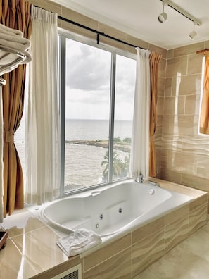 Rainfall showerhead, designer toiletries, hair dryer, towels