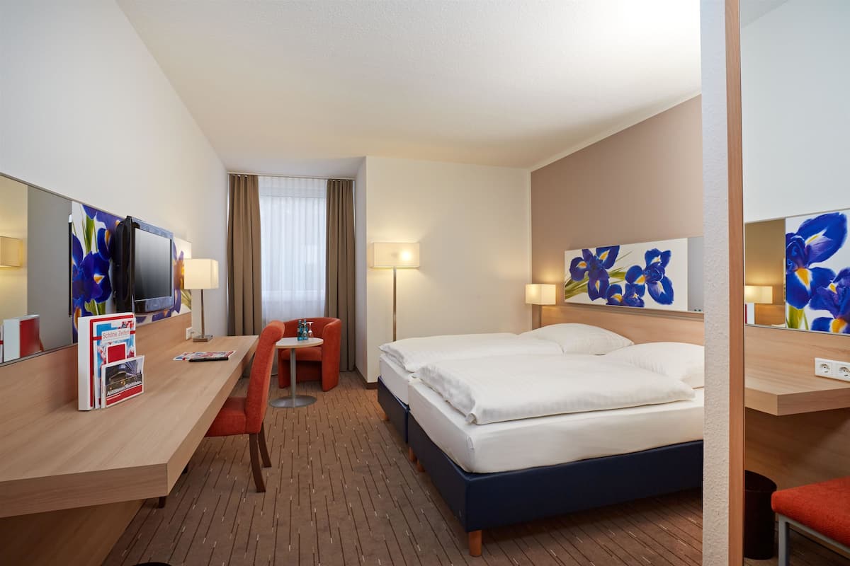 Comfort Room | Desk, iron/ironing board, free cots/infant beds, rollaway beds