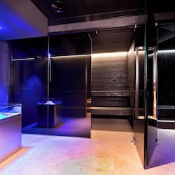 Experience a serene atmosphere in this stylish space with a prominent column and glass partitions.