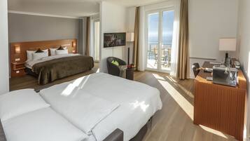 Suite, Lake View | Minibar, in-room safe, desk, blackout curtains