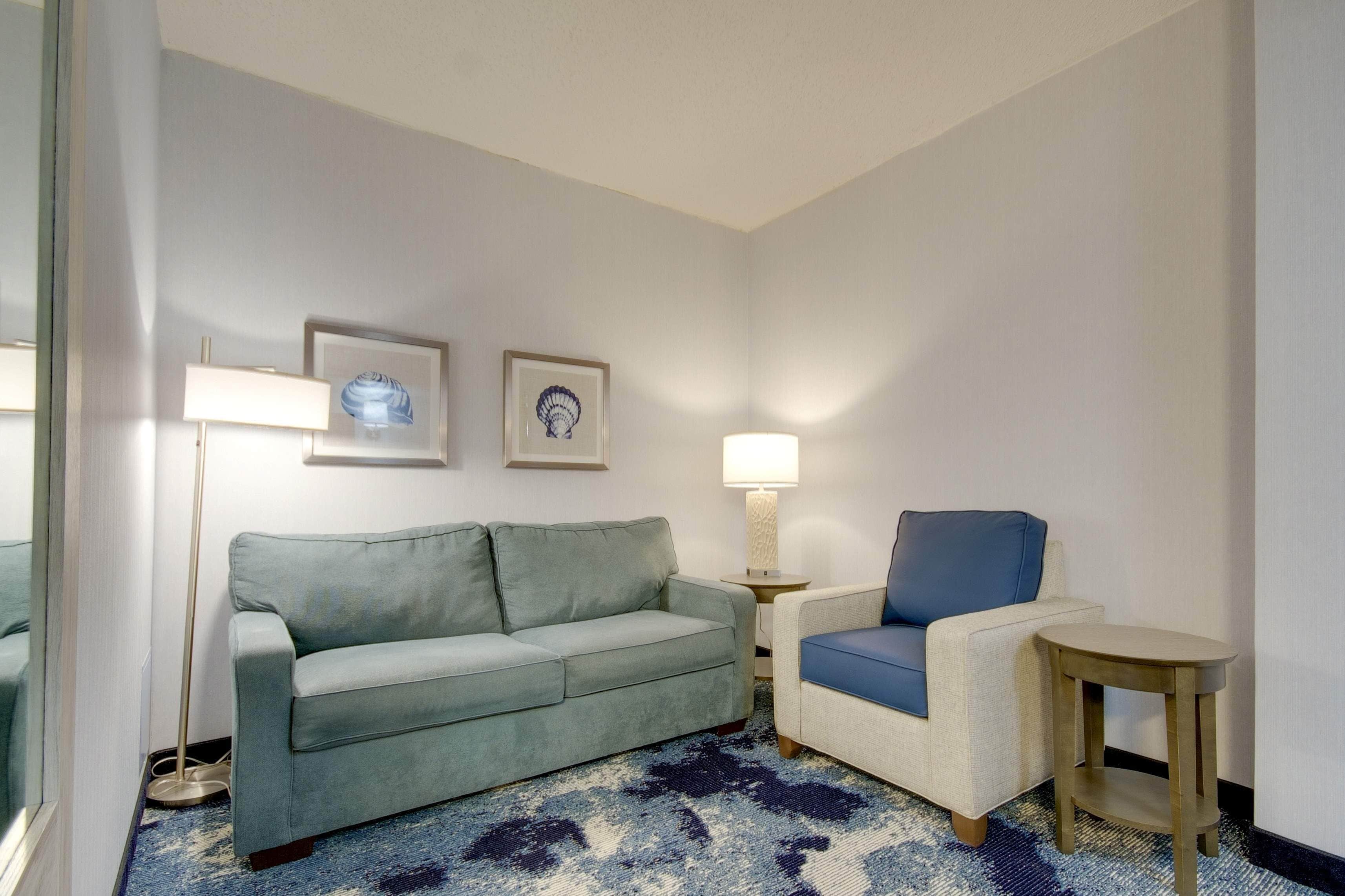 suite north, 2 queen beds  & sofa bed ,no view, no balcony | living area | tv