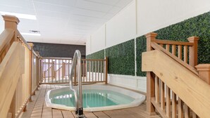 A wooden deck with a hot tub and a staircase. - Legacy Vacation Resorts - Steamboat Hilltop (Steamboat Springs)