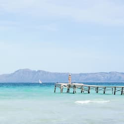 On the beach, white sand, beach towels, beach volleyball