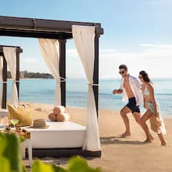 On the beach, white sand, free beach cabanas, sun loungers