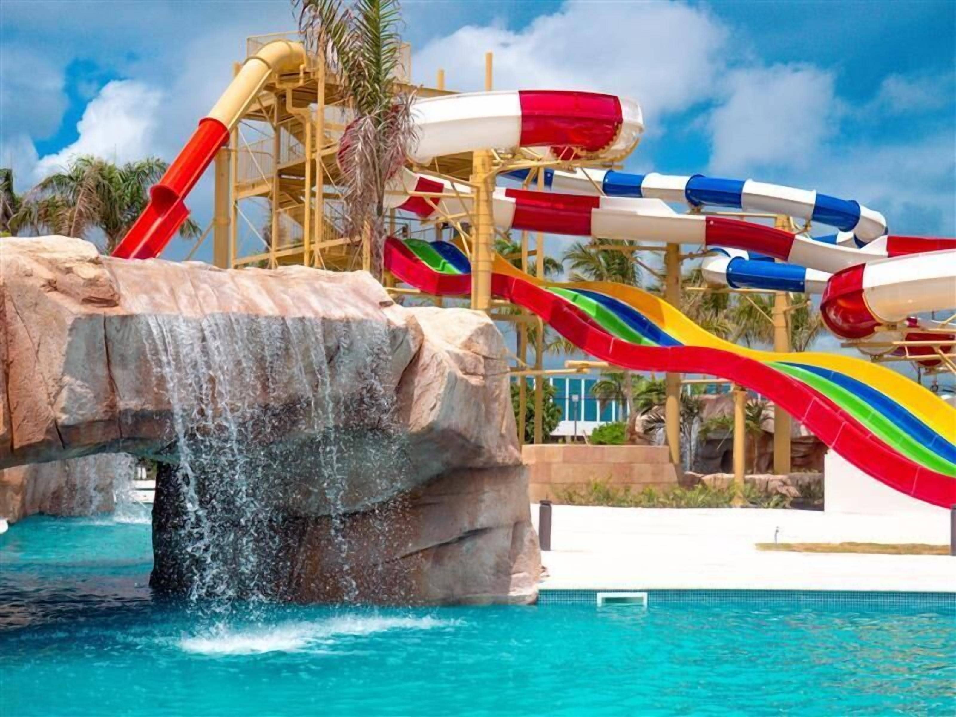 2 outdoor pools, open 8:00 AM to 7:00 PM, pool umbrellas, pool loungers