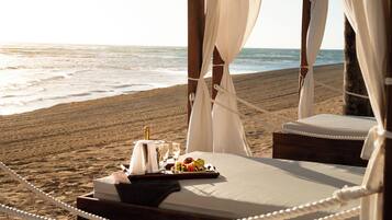 On the beach, sun-loungers, beach towels, snorkelling