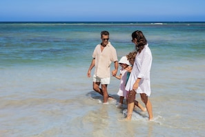 On the beach, sun loungers, beach towels, snorkeling