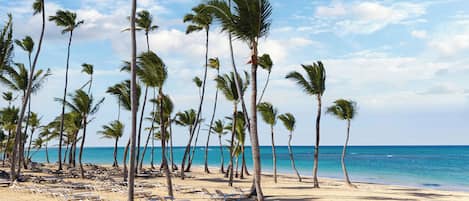 On the beach, sun-loungers, beach towels, snorkelling