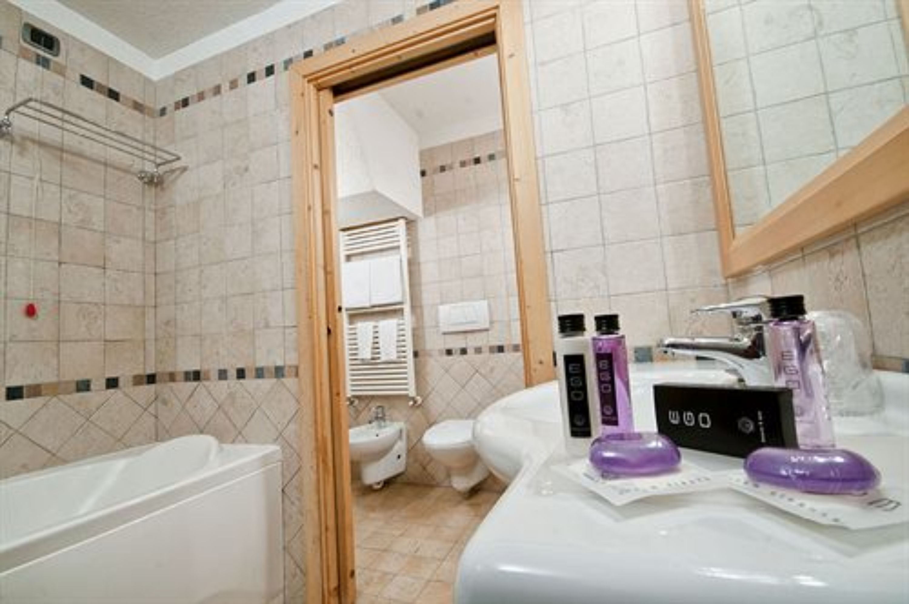 suite | bathroom | combined shower/bathtub, designer toiletries, hair dryer, bathrobes